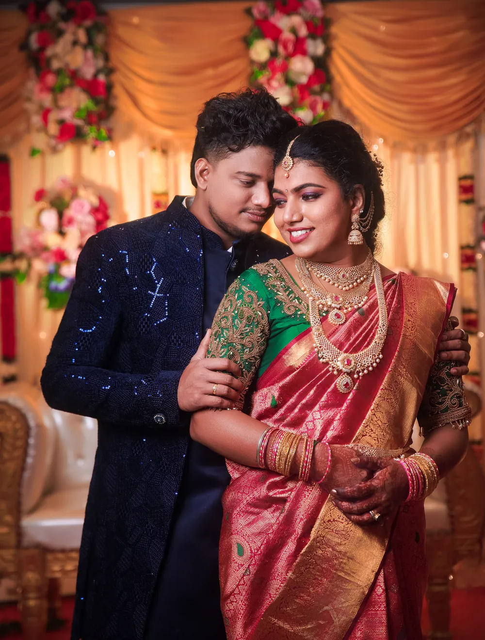 Elegant Tamil bride and groom in traditional wedding attire